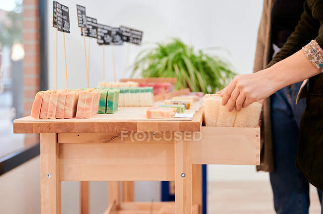 Crop anonymous female buyer shopping products in eco friendly shop — Stock Photo