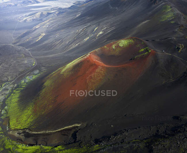 Aerial view of rough volcanic crater located in amazing highlands on cloudy day in Iceland — Stock Photo