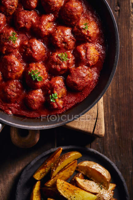 Closeup viewed from above of a plate of meatloaf with tomato — Stock Photo