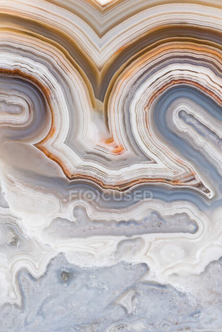Macro photograph of the banding pattern in a Crazy Lace agate from Mexico — Stock Photo