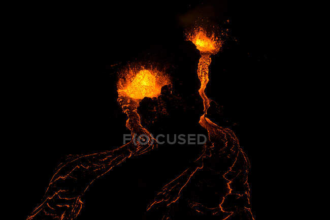 From above magma sparks out of the volcano hole and run like rivers of lava over the ground in Iceland — Stock Photo