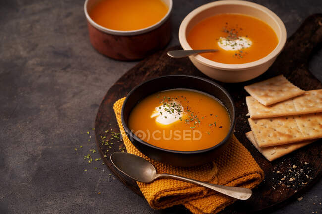 Delicious plates of creamy pumpkin soup seen from above — Stock Photo
