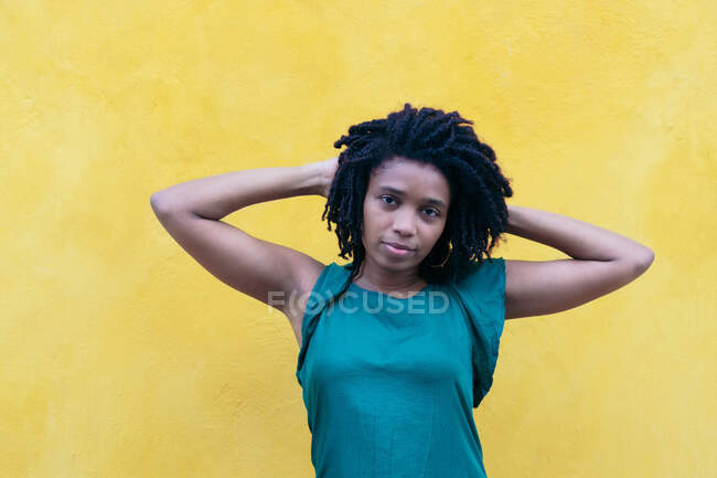 Portrait of young woman with dreadlocks in the street — Stock Photo