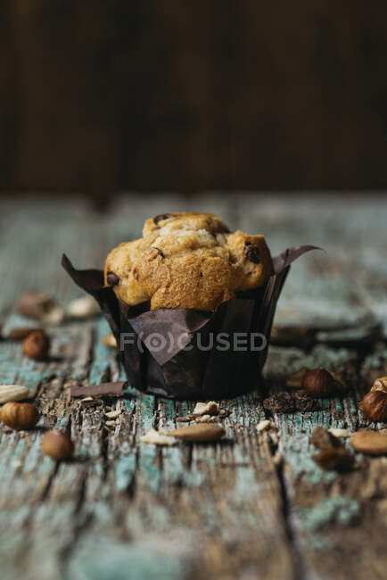 Front view of a muffin with chocolate chips and nuts — Stock Photo