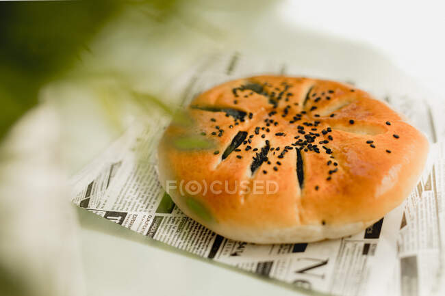 Azuki cake placed on table over a newspaper — Stock Photo