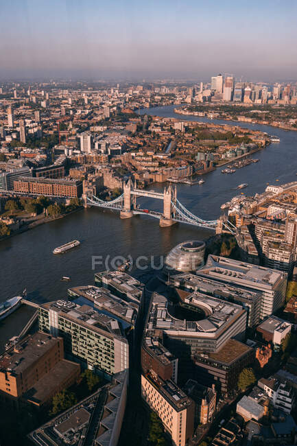 Drone view of Tower Bridge over Thames river and buildings of central district of London — Stock Photo
