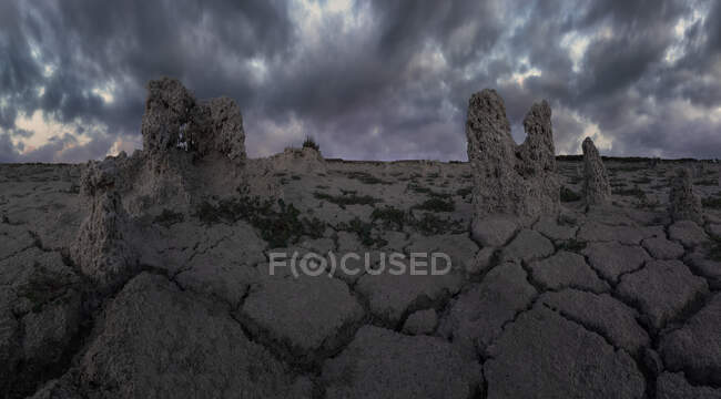 Picturesque scenery of rocky formations in salty lagoon in Penahueca on background of cloudy sky — Stock Photo