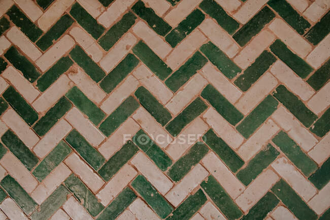 Background of stripped tiled wall in white and green — Stock Photo