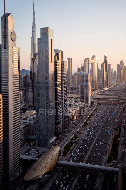 Amazing skyline of modern towers of Dubai city seen from high viewpoint at sunset time with clear sky — Stock Photo