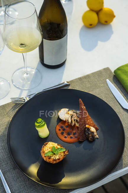 Delicious and well decorated lobster's dish at outdoor high cuisine restaurant — Stock Photo