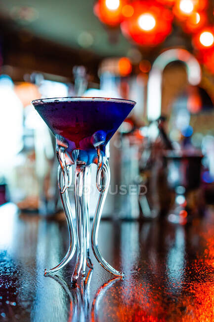 Low angle of refreshing flavor blaster cocktail in glass served on counter in bar — Stock Photo