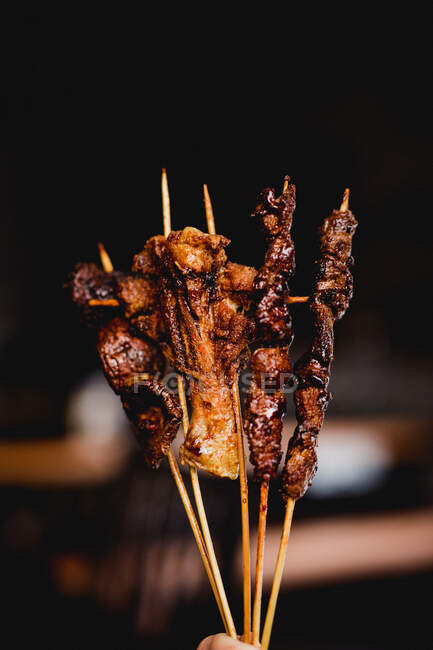 From above composition of tasty grilled skewers with meat, fish, squid and broccoli in cafe — Stock Photo
