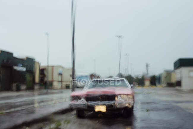 Front view of blurred classic car on a rainy day — Stock Photo