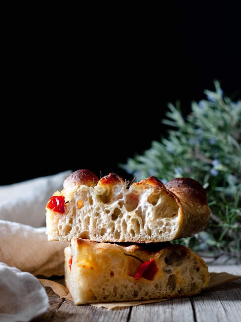 Close up of one piece of fresh tomato focaccia with rosemary — Stock Photo