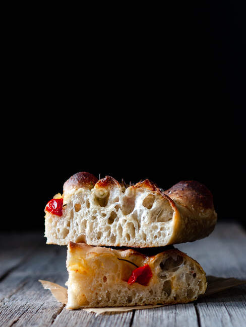Close up of one piece of fresh tomato focaccia with rosemary — Stock Photo