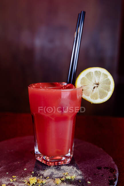 Glass of Bloody Mary cocktail made of vodka and tomato juice served with slice of lemon — Stock Photo