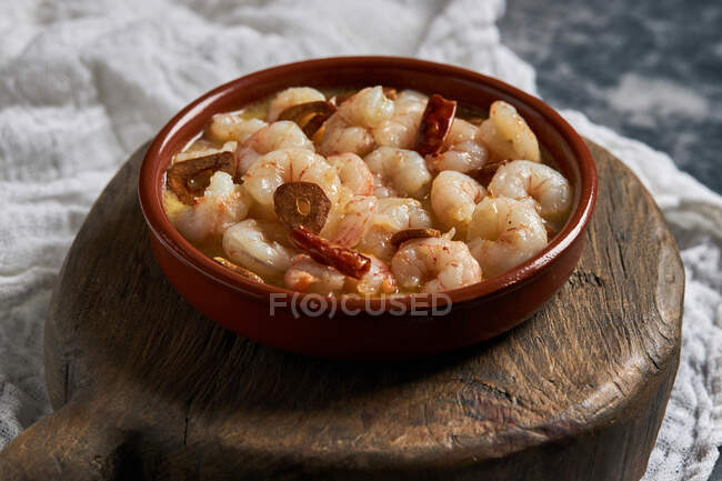 From above bowl of delicious prawn soup with chili peppers served on table in restaurant — Stock Photo