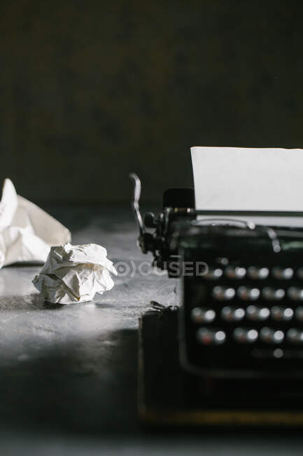 Retro vintage typewriter standing on old wooden table — Stock Photo