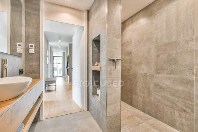 Interior of stylish clean bathroom with gray tiled walls and in modern apartment — Stock Photo