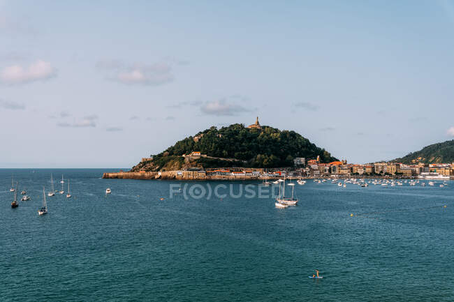Picturesque scenery of modern sailboats floating in blue rippling water of ocean near San Sebastian in Spain in sunny day — Stock Photo