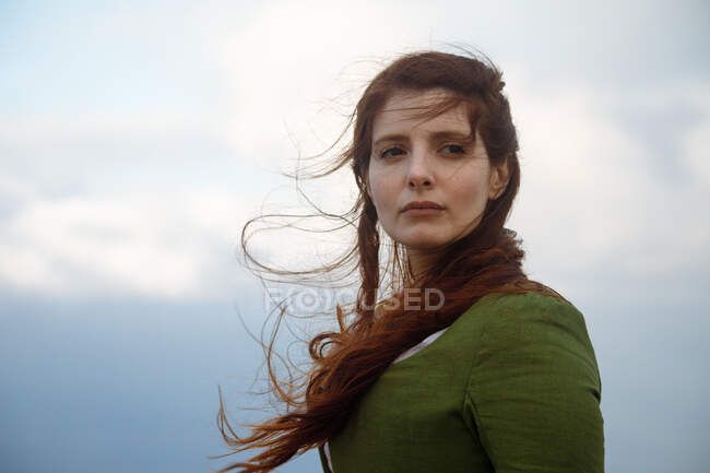 From below dreamy female in old fashioned clothes portrait in misty weather — Stock Photo