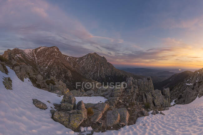Wide angle of landscape of snowy mountains at sunset. National Park Sierra de Guadarrama, Spain — Stock Photo