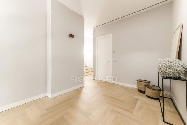 Interior of spacious hall with white walls and parquet floor in contemporary flat in minimal style — Stock Photo