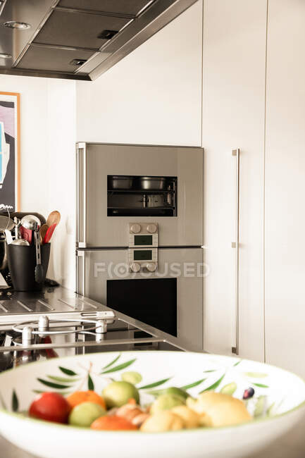 Control panel with switches and display on electric oven in modern home kitchen — Stock Photo