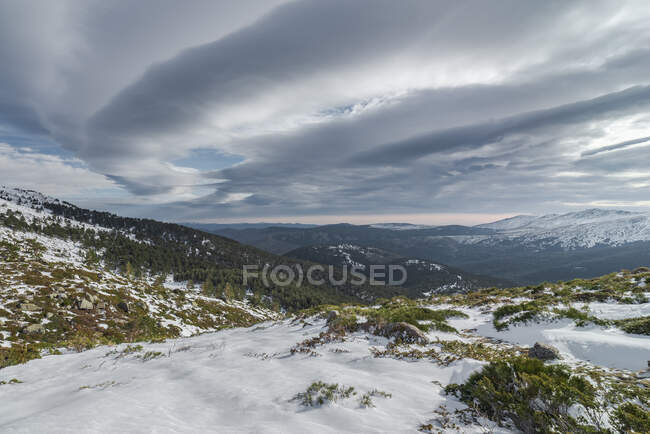 Landscape of snowy mountains covered by clouds. National Park Picos de Europa, Spain — Stock Photo