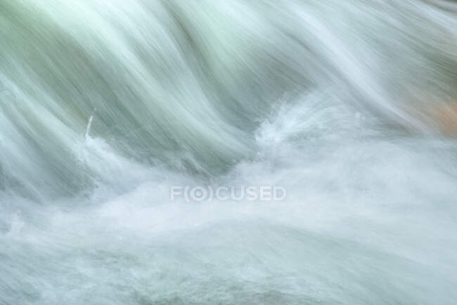 Abstract background of waterfall and river with foamy splashes and rapid aqua streams in daylight in Lozoya, Madrid, Spain — Stock Photo
