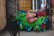 Feet of barefoot little boy in pajamas — Stock Photo