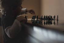 Little boy playing with toy soldiers — Stock Photo