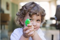 Adorable little boy playing with toy — Stock Photo