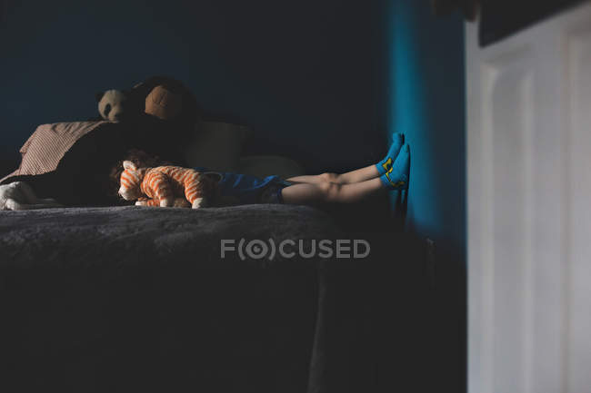 Boy lying in bed — Stock Photo