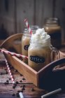 Coffee and cream in glass jar — Stock Photo