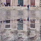 Cathedral reflected in puddle — Stock Photo