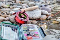 Fishing gear on pebbles — Stock Photo