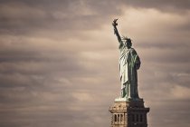 Statue Of Liberty against cloudy sky — Stock Photo