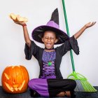 Girl in witch costume — Stock Photo