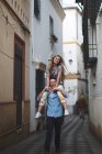 Happy couple walking on urban street — Stock Photo