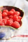 Raspberries in pot — Stock Photo