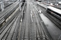 Railway tracks with passing high-speed train — Stock Photo