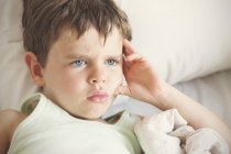 Boy looking away with facial expression — Stock Photo