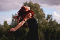 Redhead woman jumping — Stock Photo
