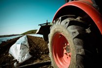 Tractor on cultivated ground — Stock Photo