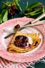 Pancakes with roasted cherry — Stock Photo