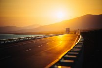 View of empty road at sunset — Stock Photo