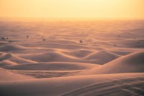 Vista de dunas de areia ao pôr do sol — Fotografia de Stock