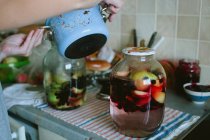 Woman cooking compote — Stock Photo