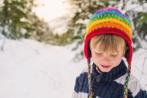 Boy in hat looking down — Stock Photo